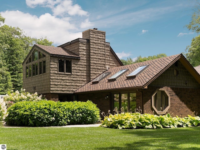 view of side of home featuring a lawn