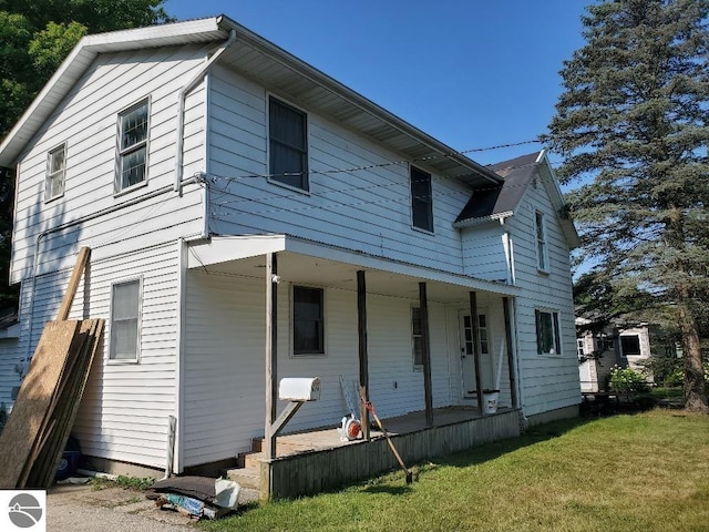 back of house with a yard