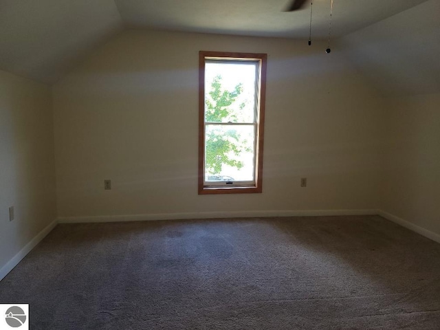 bonus room featuring lofted ceiling, ceiling fan, and carpet flooring