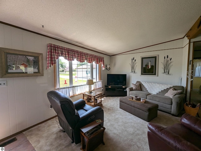 living room with ornamental molding and a textured ceiling