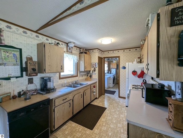 kitchen with dishwasher, sink, light tile patterned floors, and a textured ceiling