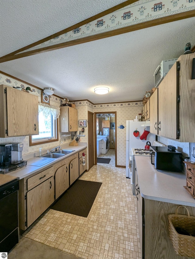 kitchen with light tile patterned flooring, black dishwasher, sink, and a textured ceiling