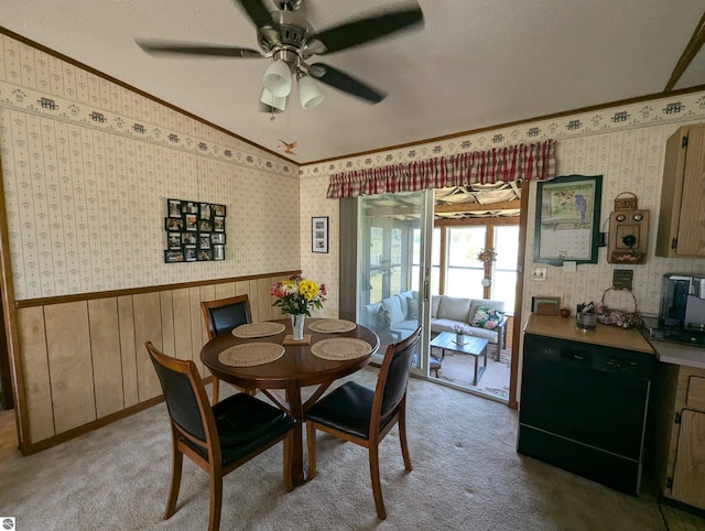 dining room featuring carpet flooring, lofted ceiling, ceiling fan, and crown molding