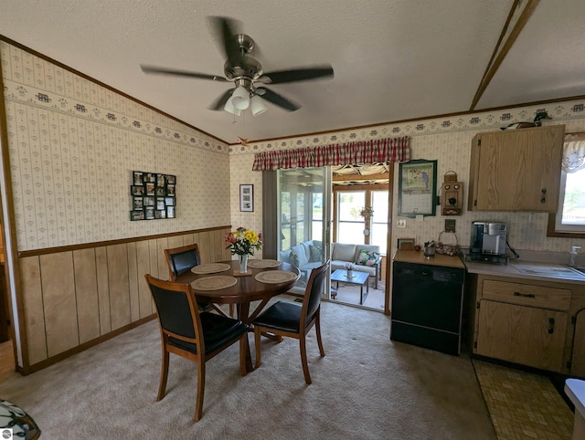 dining space featuring plenty of natural light, ceiling fan, lofted ceiling, and light colored carpet