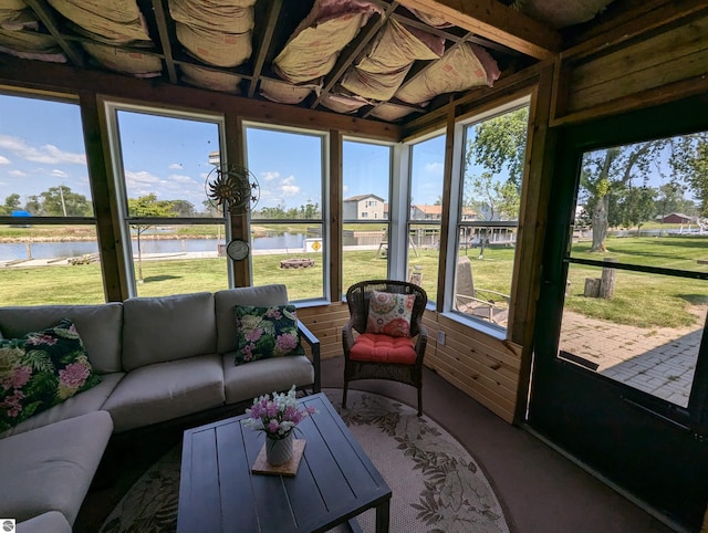 sunroom with a water view