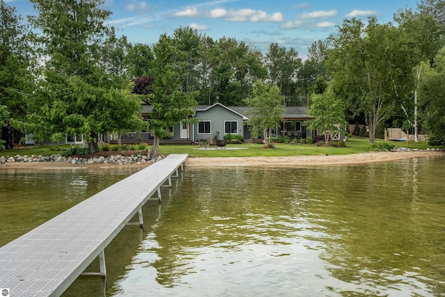 dock area featuring a yard and a water view