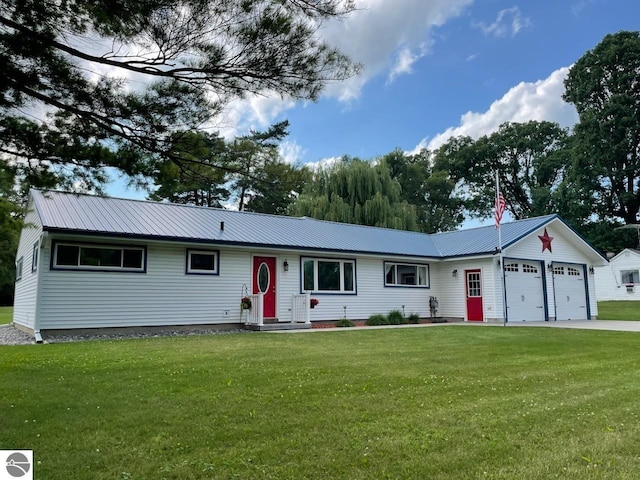 single story home featuring a garage and a front lawn