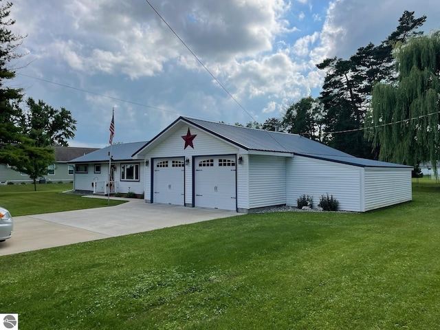 view of front of home featuring a garage and a front lawn