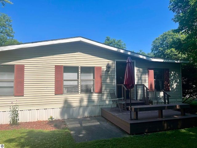 view of front facade with a wooden deck