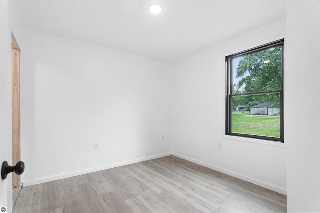 spare room featuring light hardwood / wood-style floors