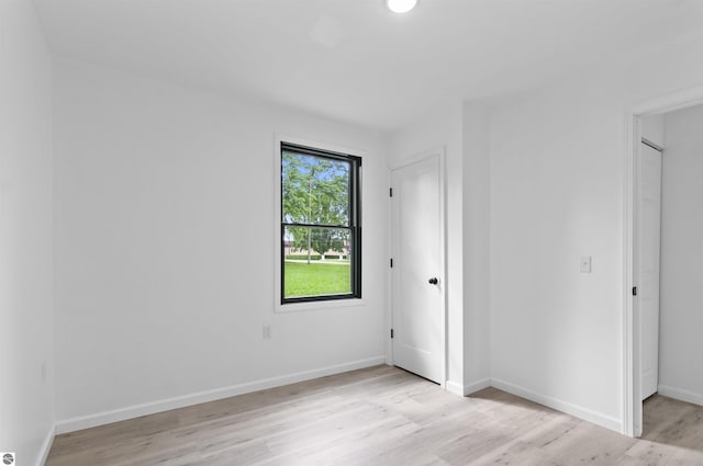 spare room featuring light wood-type flooring