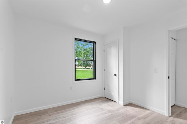 spare room with light wood-type flooring