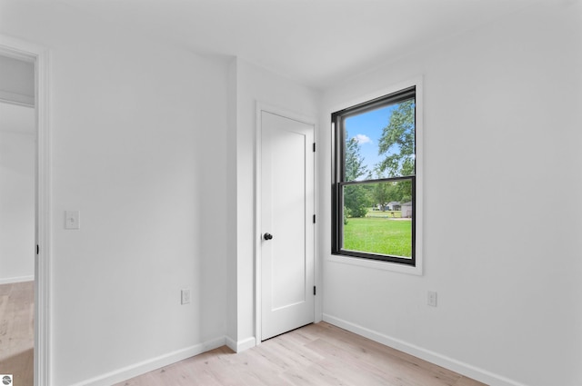 unfurnished bedroom with light wood-type flooring