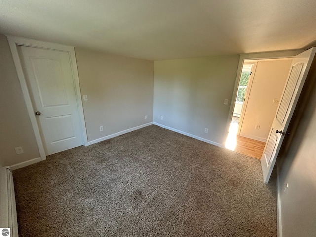 unfurnished bedroom featuring carpet