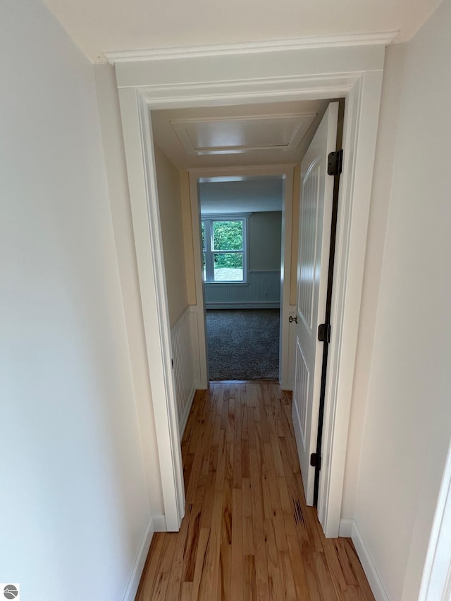 hall with wood-type flooring