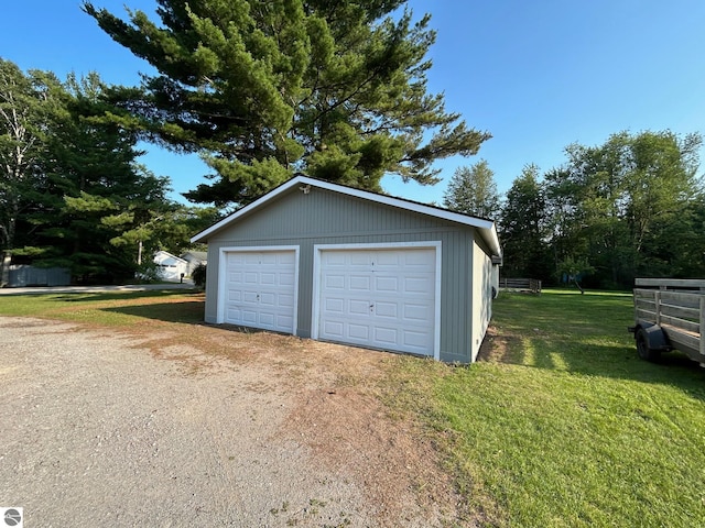 garage with a lawn