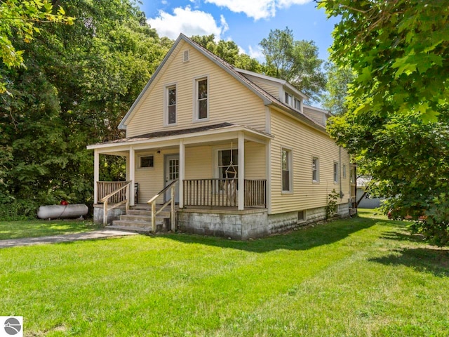 view of front of property with covered porch and a front lawn