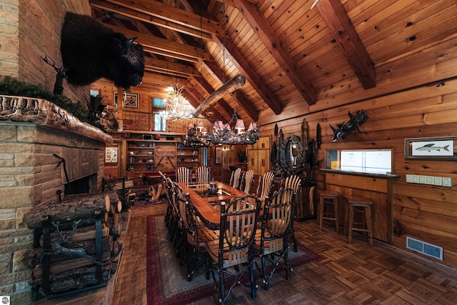 unfurnished dining area with vaulted ceiling with beams, wooden walls, an inviting chandelier, dark parquet flooring, and wooden ceiling