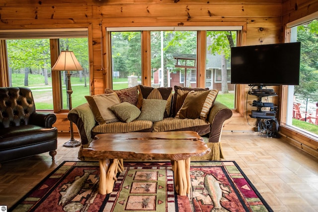 living room with wood walls