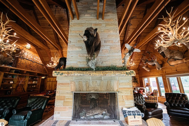 living room with beam ceiling, wood-type flooring, wood ceiling, and high vaulted ceiling