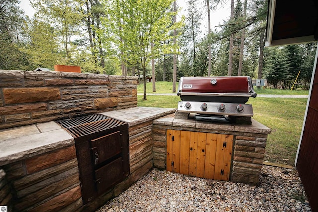 view of patio featuring a grill