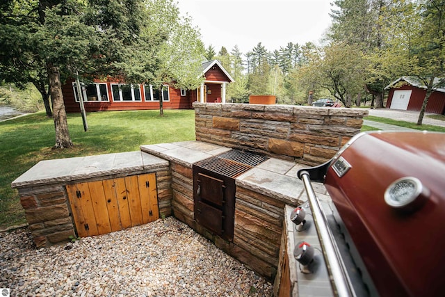 view of patio featuring area for grilling and a garage