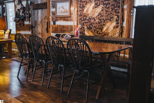 dining room with dark hardwood / wood-style flooring