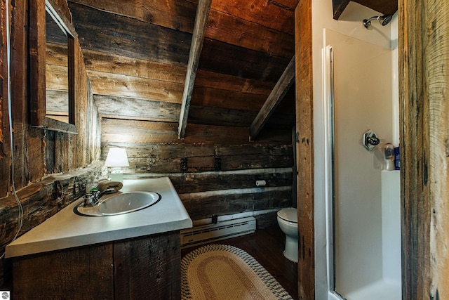 bathroom with vanity, hardwood / wood-style floors, wooden walls, toilet, and baseboard heating