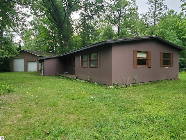 view of property exterior featuring a lawn