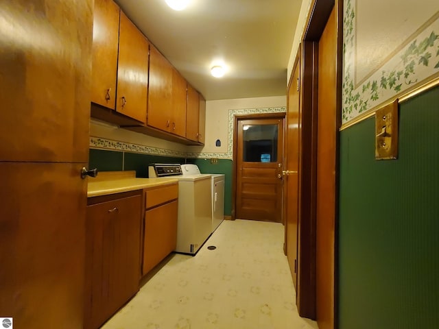 kitchen with separate washer and dryer and light tile patterned floors