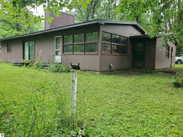 exterior space featuring a front lawn