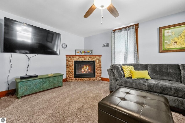 224 Saint Marys St, Suttons Bay, MI 49682 - living area with carpet flooring, a fireplace, baseboards, and ceiling fan