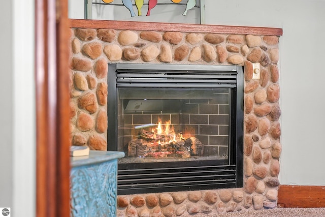 224 Saint Marys St, Suttons Bay, MI 49682 - details featuring a stone fireplace