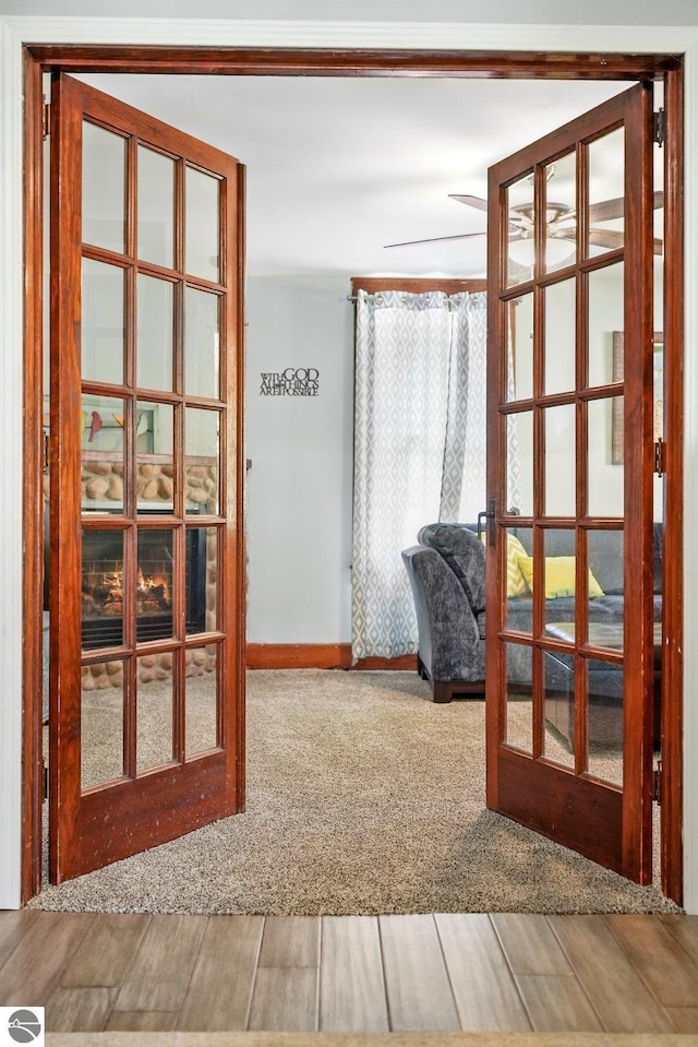 224 Saint Marys St, Suttons Bay, MI 49682 - entryway with french doors, wood finished floors, baseboards, and carpet floors