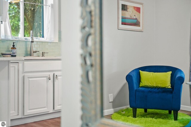 224 Saint Marys St, Suttons Bay, MI 49682 - sitting room featuring baseboards and wood finished floors