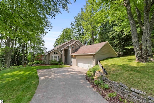 view of front of property featuring a garage and a front yard