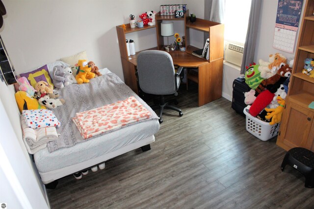 bedroom with wood-type flooring