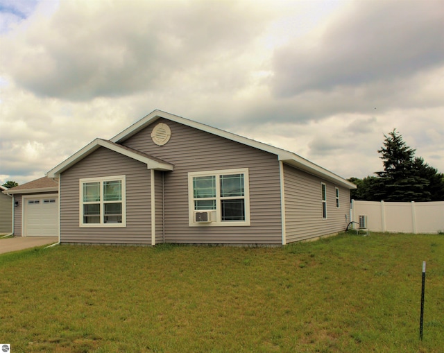 view of front of property with a garage and a front yard