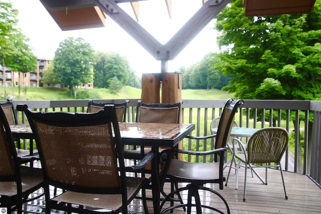 wooden deck with outdoor dining area