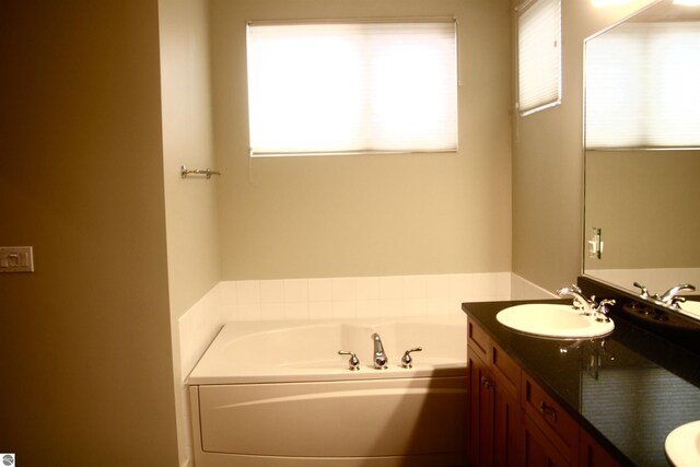 bathroom featuring tile patterned floors, separate shower and tub, and vanity