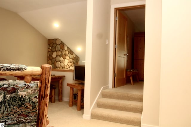 bedroom featuring lofted ceiling and light colored carpet