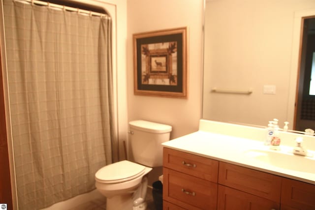 full bath with toilet and vanity