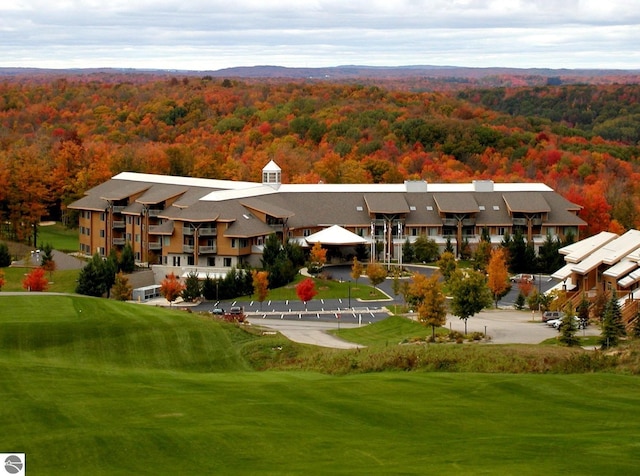 birds eye view of property with a wooded view