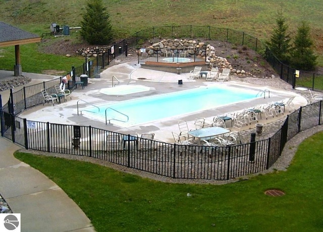 view of swimming pool with a patio