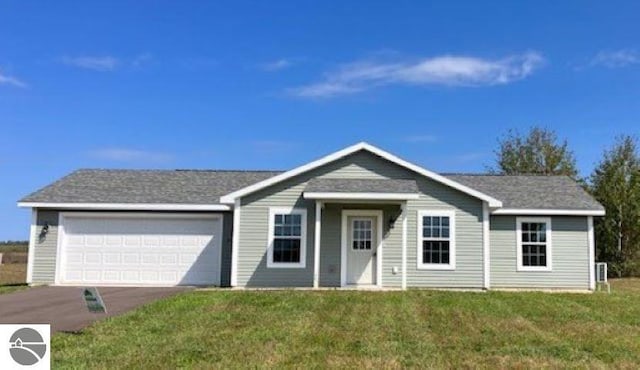 ranch-style house with a garage and a front yard