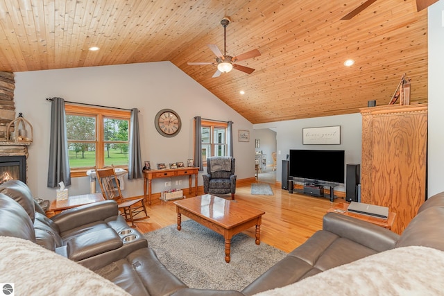 living room with high vaulted ceiling, a fireplace, ceiling fan, wooden ceiling, and light hardwood / wood-style flooring