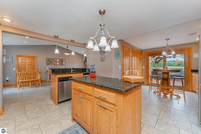 kitchen featuring decorative light fixtures, a chandelier, a center island, vaulted ceiling, and dishwasher