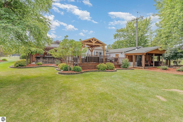 view of yard with a gazebo and a wooden deck