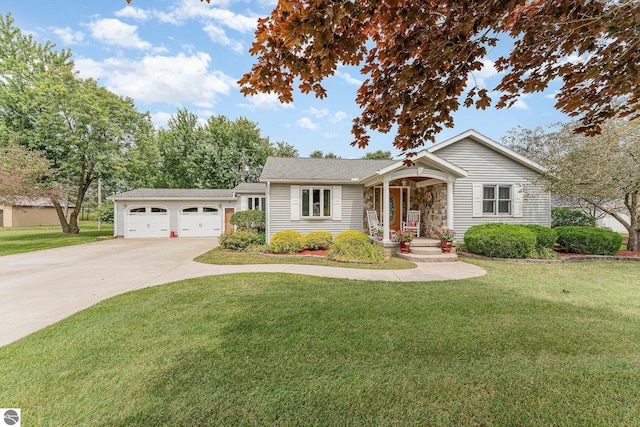 view of front of property featuring a garage and a front yard