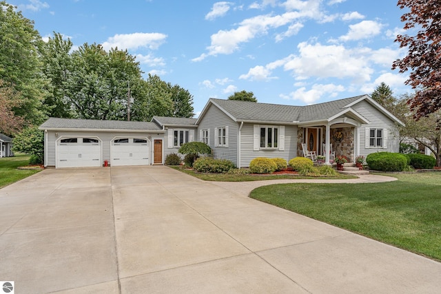 ranch-style house with a garage and a front yard